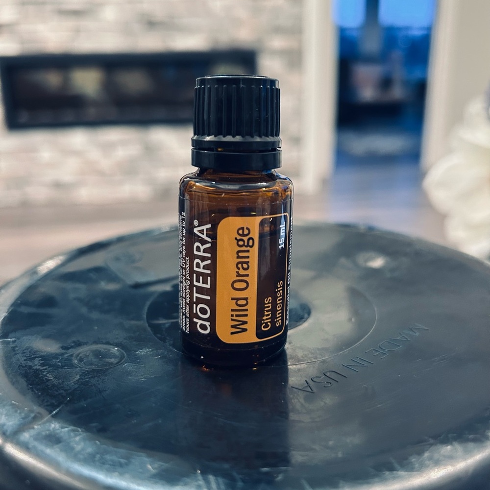Doterra Wild Orange Bottle with Yellow Label and Black Cap